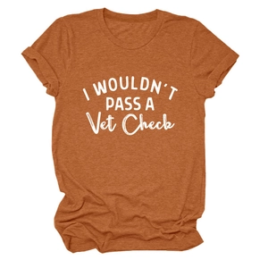 Close-up of rust orange cotton T-shirt with I Wouldn't Pass A Vet Check print and rolled sleeves