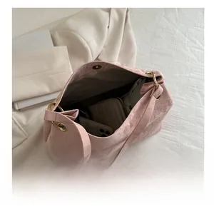 Detail view of the pink tote bag interior showing large capacity for daily items