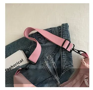 Close-up of pink tote bag showing durable fabric and wide woven shoulder strap detail