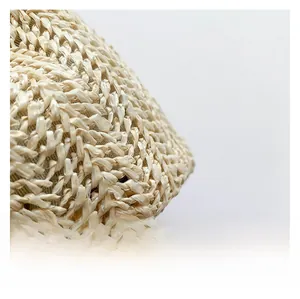 Macro shot of natural raffia weave texture and dense craftsmanship for beach bag