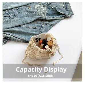 Top view of woven straw bucket bag showing interior storage for phone and cosmetics