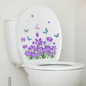 Purple crocus floral and butterfly self-adhesive wall stickers on a white toilet lid
