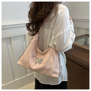 Chic pink marble hobo bag with silver butterfly pendant and metallic chain strap detail