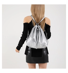 Silver metallic PU backpack detail featuring drawstring closure and unique patchwork stitching