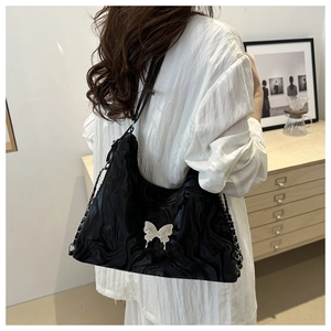 Black hobo bag with water ripple texture and silver butterfly charm for women