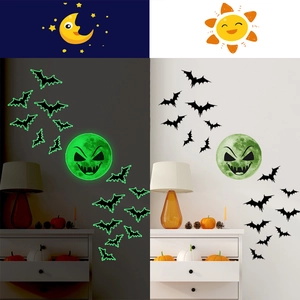 Luminous Halloween wall stickers featuring glowing green moon and bats in a dark room