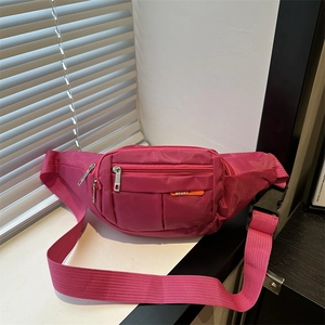 Rose red canvas waist bag with multiple zipper pockets and adjustable sport strap