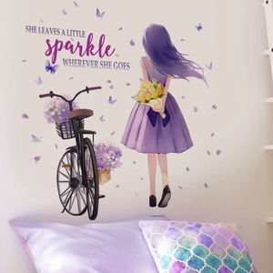 Detail of purple girl bicycle wall decal with inspirational quote for home decor