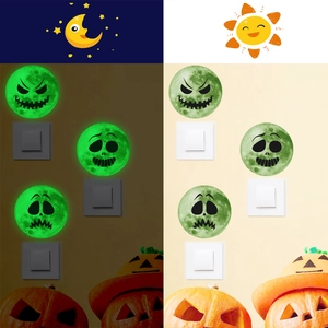Luminous Halloween wall stickers with glowing moon and pumpkin faces in day and night view