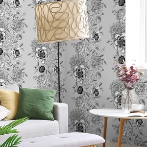 Zelfklevend bloemenbehang met zwart-wit botanische lijntekeningen in de woonkamer