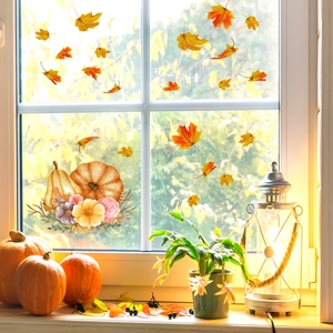 Autumn window clings with pumpkins and maple leaves set against a warm home background