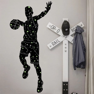 Luminous basketball player wall sticker with glowing green star pattern in a room