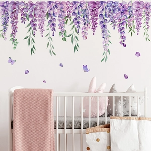 Lavender wisteria wall stickers with butterflies over a white baby crib in a cozy bedroom
