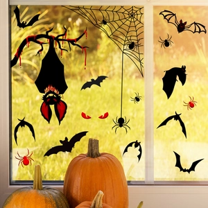 Detail of Halloween window clings featuring bats, spiders, and spooky red-eyed ghosts