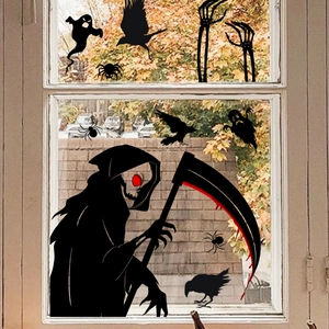 Detailed view of black ghost, skull, and crow window stickers for Halloween decor