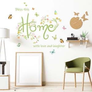 Green floral wall sticker with Bless this Home quote and butterfly accents