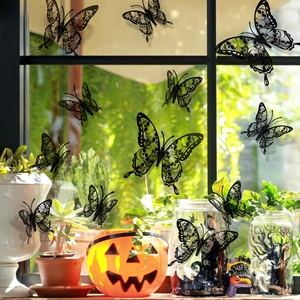 Detailed view of black 3D skull butterfly wall stickers on a pumpkin bucket decoration
