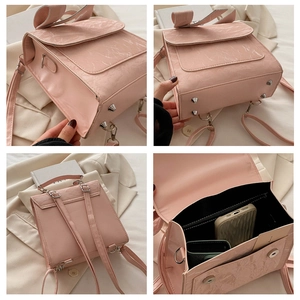 Pink butterfly backpack interior view with multiple compartments for daily items