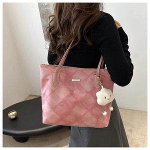 Detailed back view of pink tote bag with quilted pattern and plush cloud charm