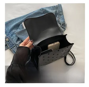 Polka dot backpack internal capacity view showing space for phone and essentials