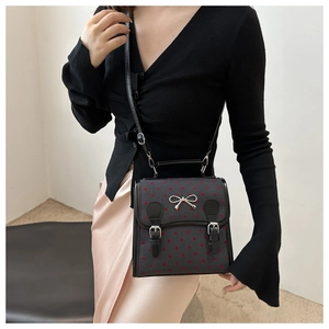 Vintage Retro-Handtasche mit Punkten, silberner Schleife und verstellbarem Schultergurt