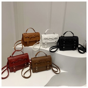 British style handbags in five colors featuring heart embossing and bow accents