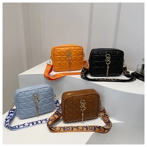 Quilted crossbody bags in four colors with wide patterned straps and gold charms