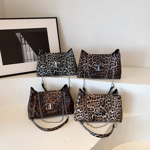 Leopard print crossbody bags with chain straps and metallic T-shaped buckle closures
