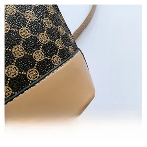 Macro shot of grainy brown patterned leather with neat white double stitching detail