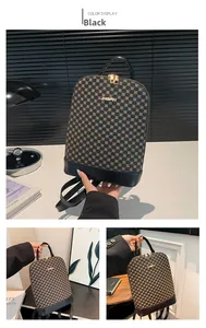Detail of a black leather backpack featuring brown geometric patterns and gold zipper