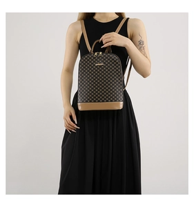 Detail of vintage-style backpack featuring brown textured PU leather and golden hardware