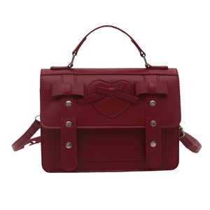 Vintage red faux leather college style satchel bag with bows and heart detail