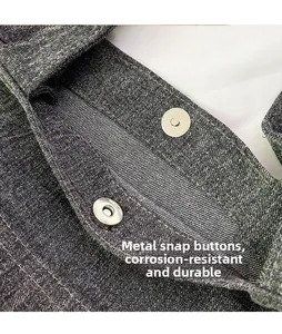 Macro detail of dark grey denim tote with durable metal magnetic snap closure