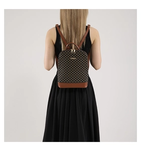 Detail view of large brown plaid backpack with dual golden zippers and faux leather straps