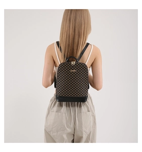 Rear view of a model wearing the brown plaid backpack with black leather straps and gold logo
