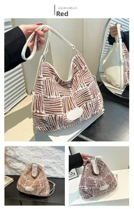 Close-up of red and white woven geometric pattern tote bag with white leather straps