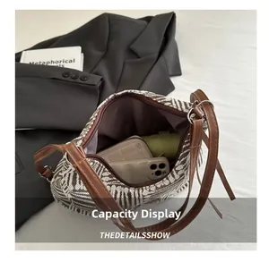 Top view of spacious interior of checkered canvas bag showing large storage capacity