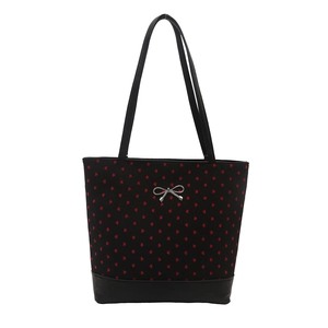 Large black tote bag with red heart patterns and silver bow detail for women