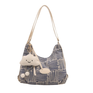 Blue and white plaid tote bag with cream shoulder strap and plush cloud charm