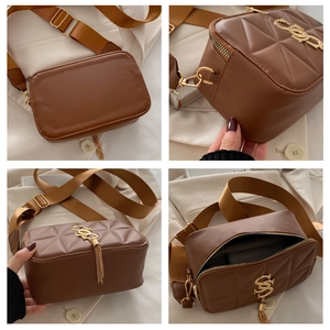 Close-up of brown quilted crossbody bag with golden S-pendant and nylon strap