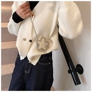 Chic star-shaped crossbody bag covered in white rhinestones with a thin silver chain strap