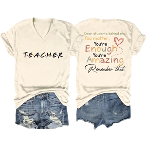 Close-up of cream V-neck teacher t-shirt back with inspirational quote print