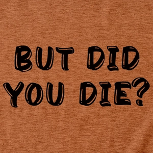 Dettaglio dello slogan nero 'BUT DID YOU DIE?' stampato su tessuto in maglia caramello