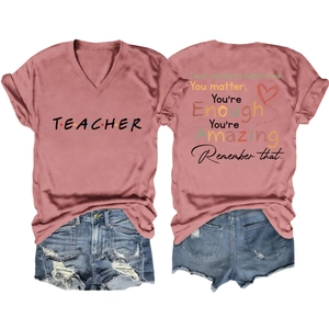 Detailed back view of pink V-neck teacher t-shirt with inspirational message