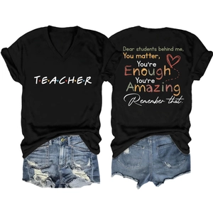 Flat lay of teacher V-neck tee with denim shorts showing front and back design