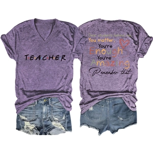 Detail of teacher slogan t-shirt back text and distressed denim shorts set