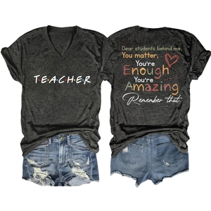 Detail of grey V-neck teacher t-shirt featuring inspirational message on the back