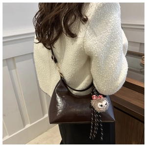Deep brown oil-wax leather hobo bag with adjustable strap and cute plush sheep charm