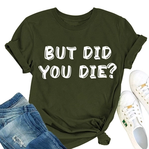 Flat lay di maglietta in cotone verde oliva con scritta BUT DID YOU DIE? e jeans denim