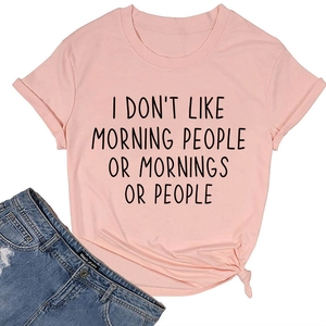 Detail of pink cotton T-shirt with black slogan and stylish front knot design